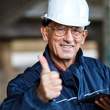 Man with hard hat thumbs up